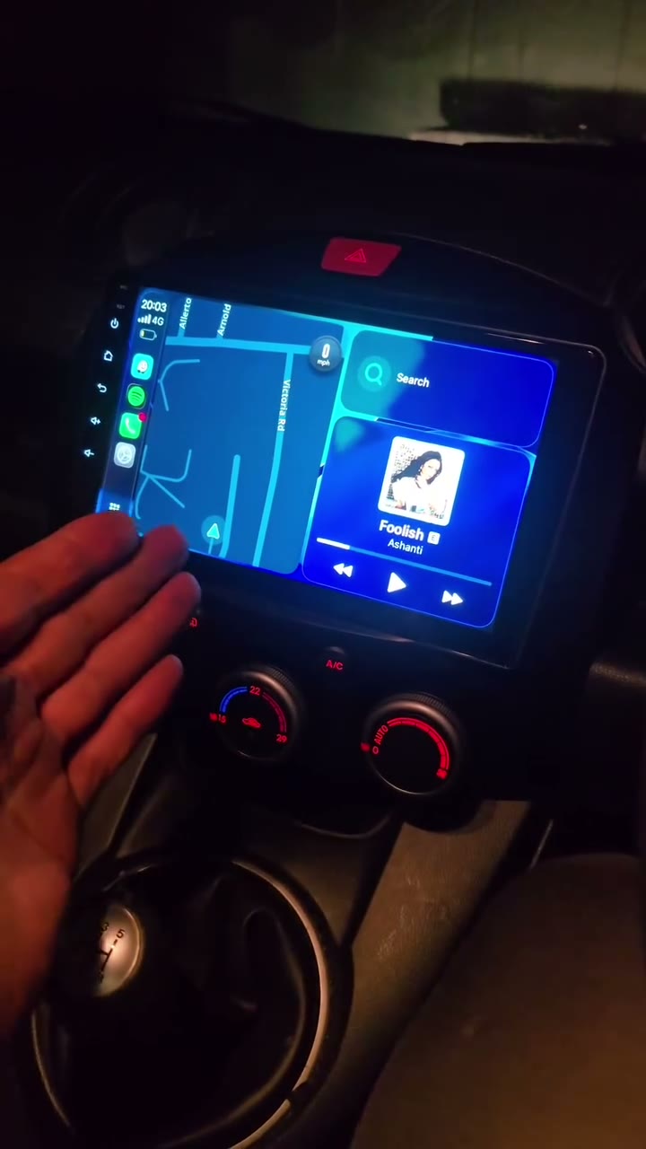 Android touchscreen showing maps and music